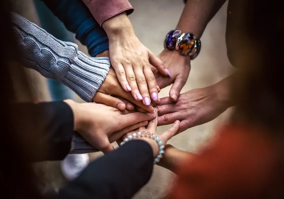 Group of hands in a circle